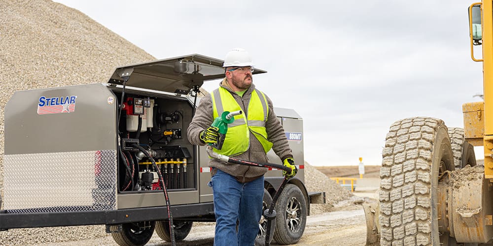 Technician using a Fuel Trailer 880 to refuel in a remote site.