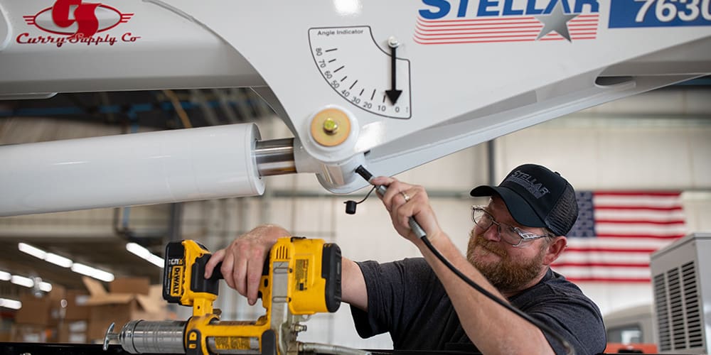 Man working on a mechanic truck.